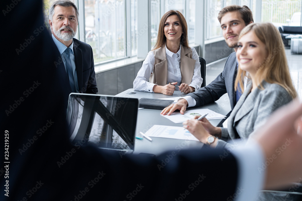 Corporate business team and manager in a meeting, close up Corporate business team and manager in a meeting, close up