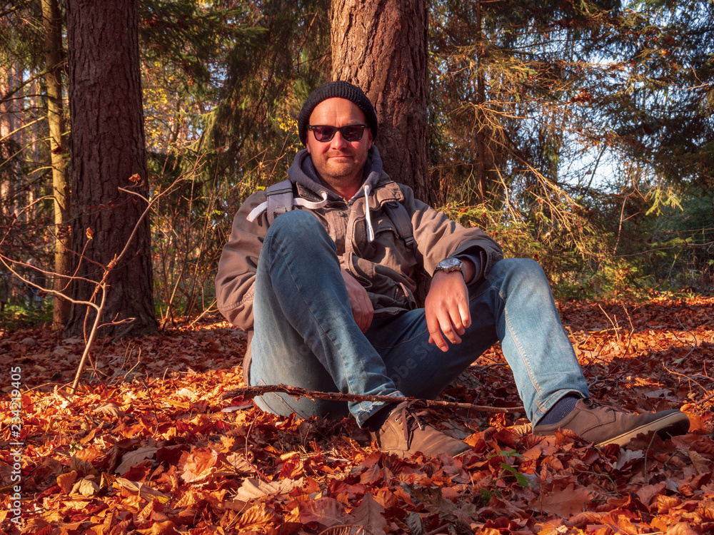 Outdoor Man Model in forest with Autumn Sun Outdoor Man Model in forest with Autumn Sun