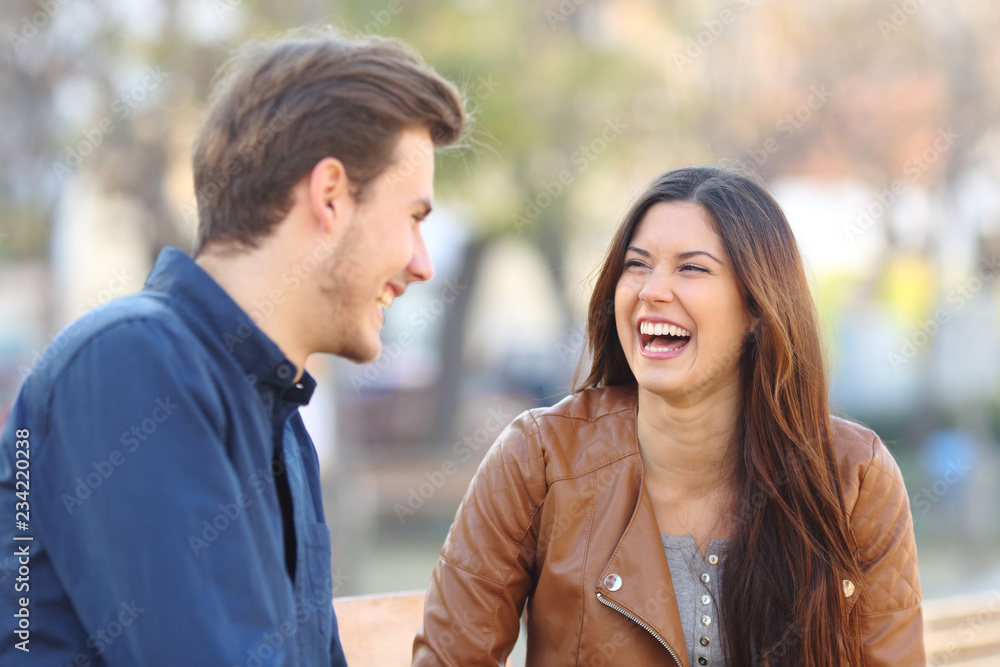 Fototapeta premium Funny couple laughing in the street