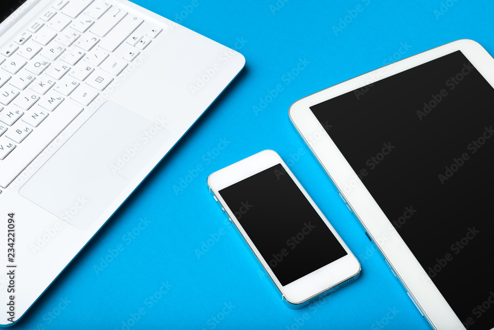 Open laptop with digital tablet on the table Open laptop with digital tablet on the table