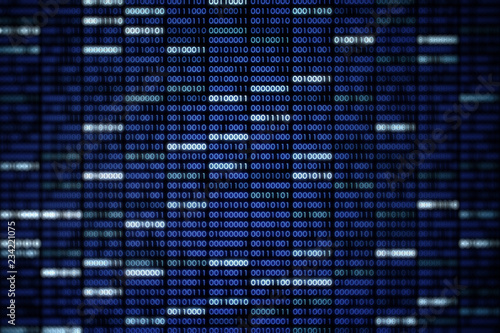 Computer display screen with blue binary code moving in the background. blur defocus blue bokeh light. technology graphic design background concepts