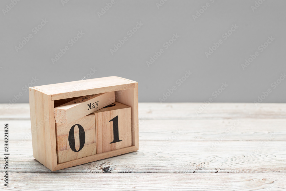 May 1st. Image of may 1 wooden color calendar on wooden background. Spring day, empty space for text. International Workers' Day May 1st. Image of may 1 wooden color calendar on wooden background. Spring day, empty space for text. International Workers' Day