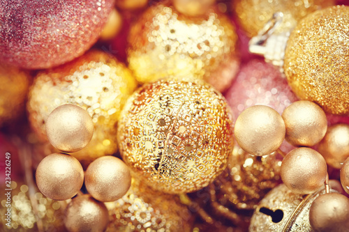 Merry Christmas and happy New year. Texture of gold Christmas toys. Christmas background.