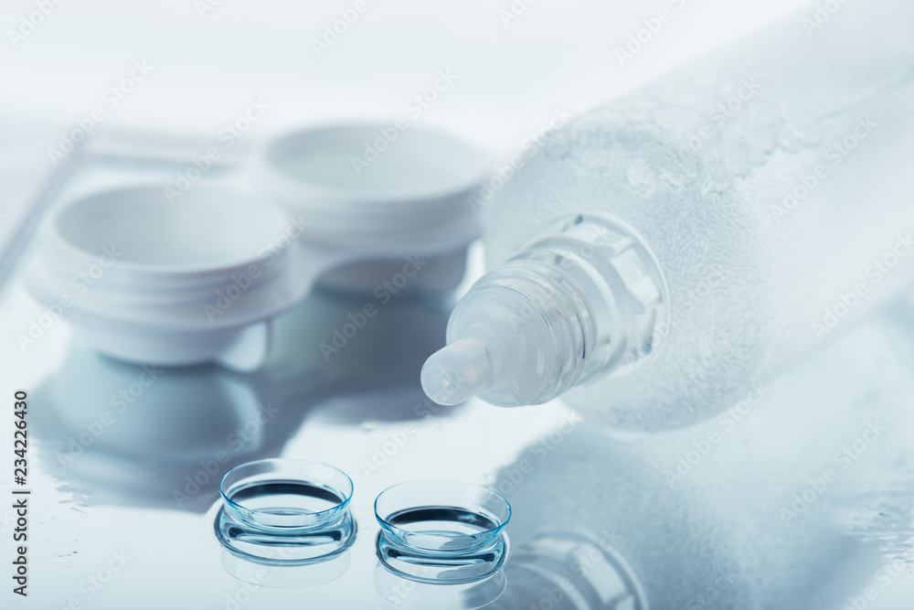 Bottle with lens solution and case Bottle with lens solution and case
