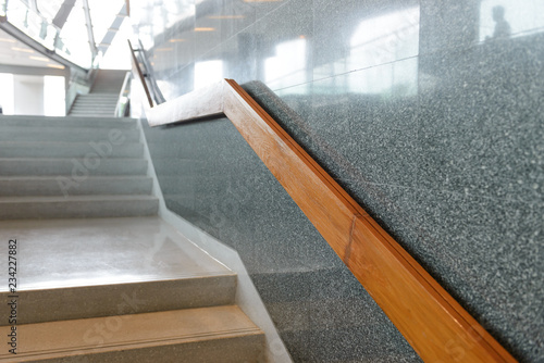 Fotografiet marble stairs with wooden handrail in building for step up or down safety - Inte