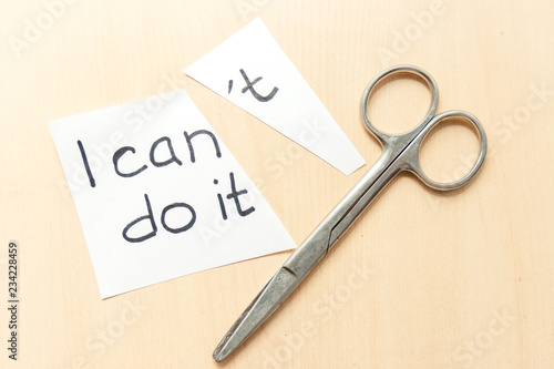 Concept of self belief, motivation an positive attitude. I can do it ,wrote on white torn paper.
