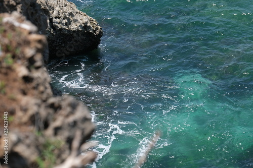 Cove near the ocean with blue and green water