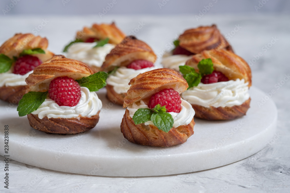 Raspberries Profiteroles with White Chocolate cream Raspberries Profiteroles with White Chocolate cream