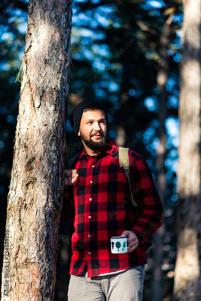 Man enjoying cup of coffee on hiking trip Man enjoying cup of coffee on hiking trip