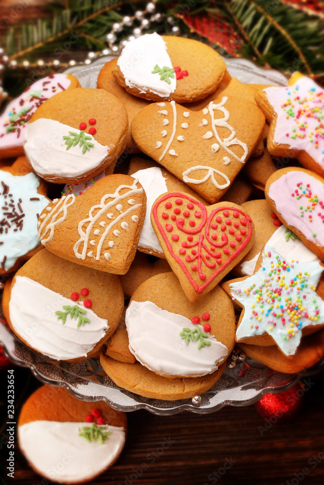 Christmas gingerbreads cookies on wooden table Christmas gingerbreads cookies on wooden table