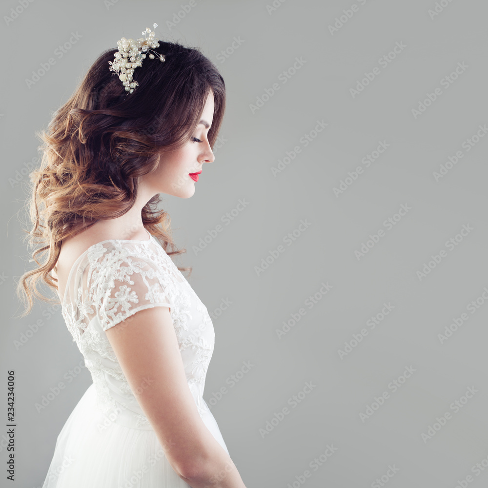 Elegant bride woman with bridal hair, makeup, hairdecor and wedding dress Elegant bride woman with bridal hair, makeup, hairdecor and wedding dress