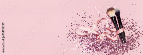 Photographie Two different Cosmetic makeup brushes with pink ribbon and holographic glitter c