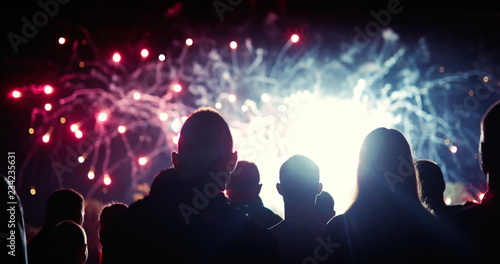 Crowd watching fireworks and celebrating new year eve