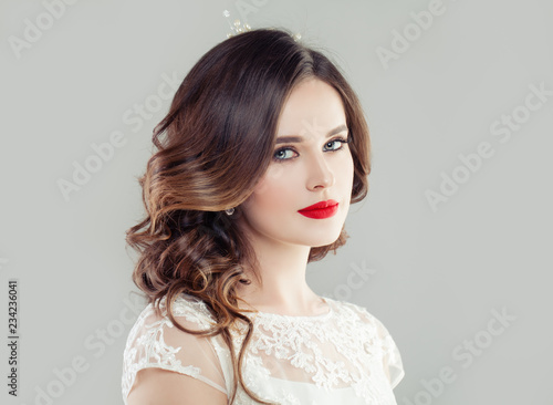 Young brunette woman. Beautiful bride with makeup and bridal hairstyle