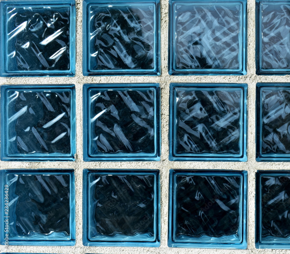 Blue glass bricks texture. Blue glass bricks background with white lines.