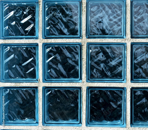 Obraz na płótnie Blue glass bricks texture. Blue glass bricks background with white lines. w salonie