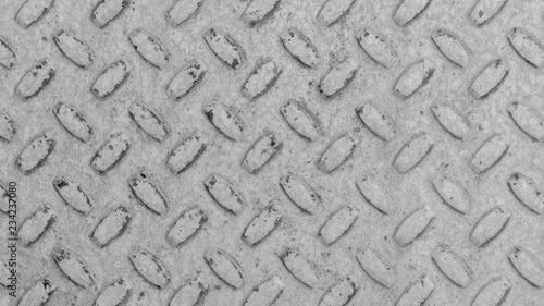 Steel sheet with notches - gray vintage metal abstract light coloured black and white background, texture close-up