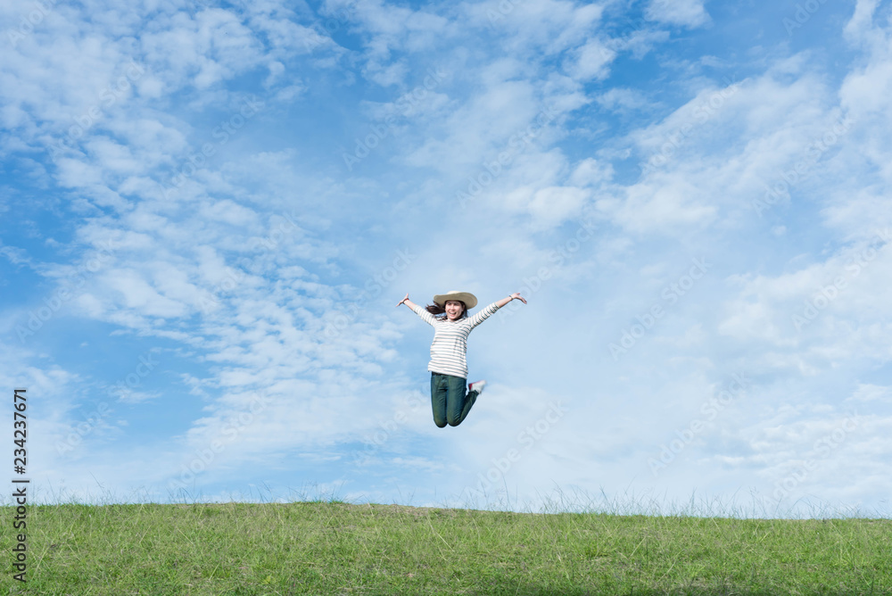 Women are happily jumping on the mountain. Women are happily jumping on the mountain.