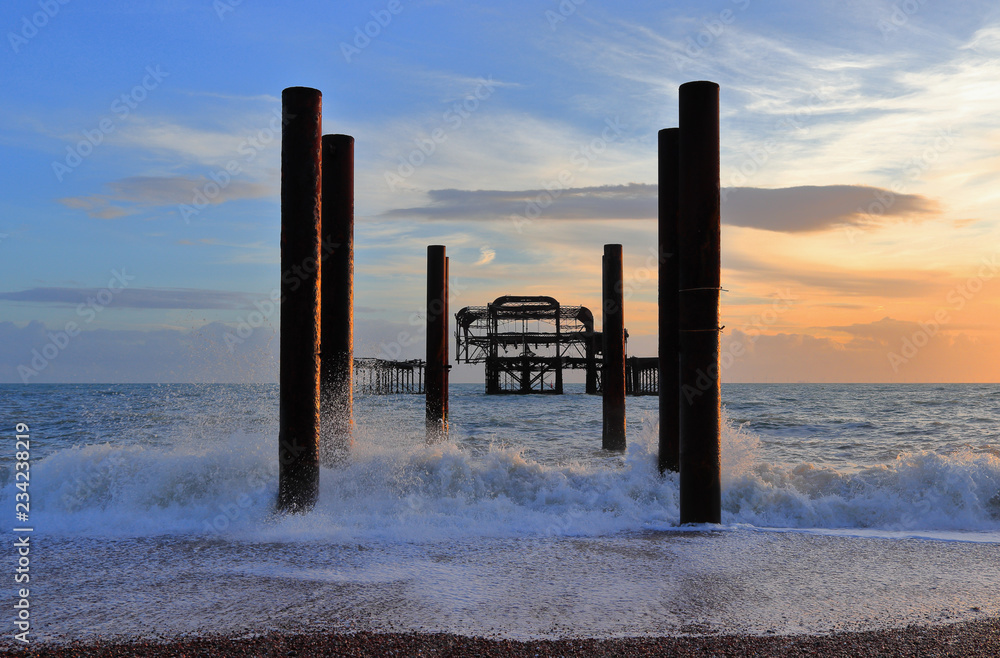 The steel skeleton of Brighton's historic West Pier in the surf. South coast of England, seaside resort Brighton and Hove, East Sussex, United Kingdom.