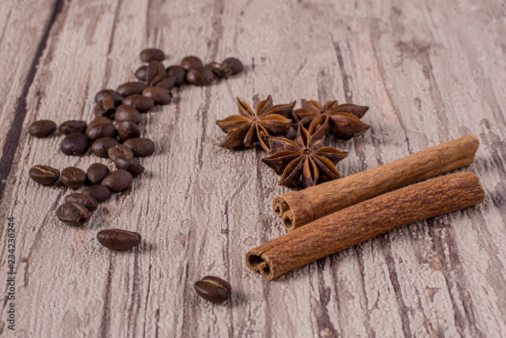 Spices and coffee beans on wooden table. Spices and coffee beans on wooden table.
