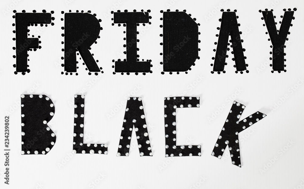 Words BLACK FRIDAY are cut out from black carton paper. Words BLACK FRIDAY are cut out from black carton paper.