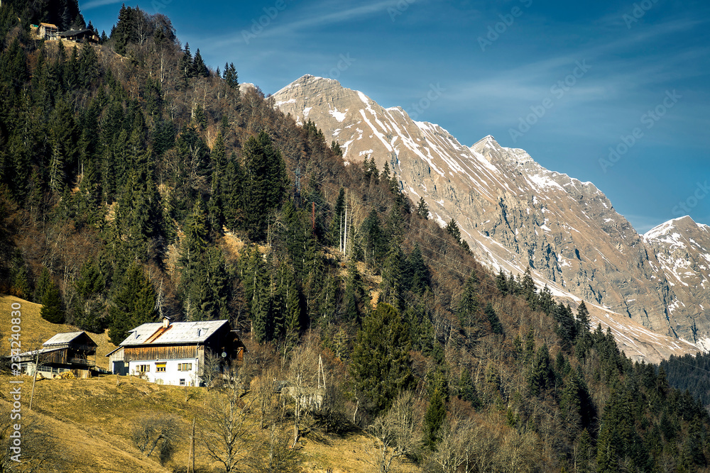 The view on winter houses located in ski resort in France, Tignes. Snowy, sunny day.