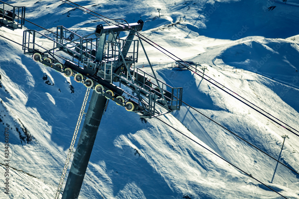 Obraz premium Beautiful. winter landscape on snowy mountains in France, Tignes. Ski resort on sunny day. The view on ski lift.