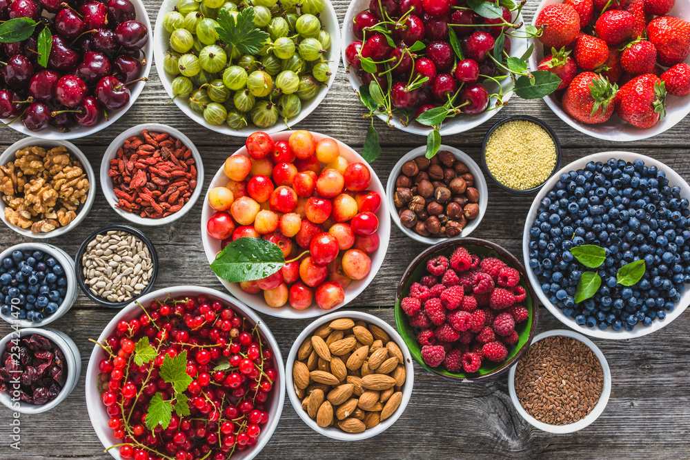 Organic food selection. Fruit, fresh berries and nuts. Healthy superfood assortment. Organic food selection. Fruit, fresh berries and nuts. Healthy superfood assortment.