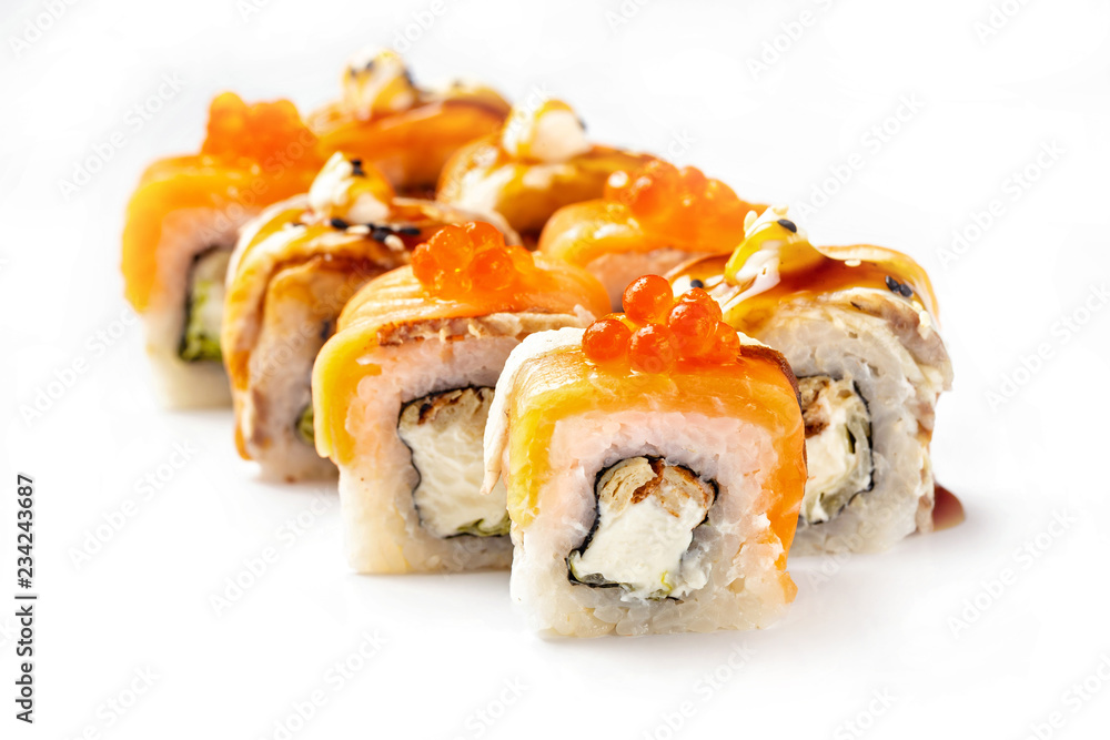 Closeip image of classic philadelphia sushi rolls with salmon, cream cheese, eel and red caviar isolated at white background. Closeip image of classic philadelphia sushi rolls with salmon, cream cheese, eel and red caviar isolated at white background.