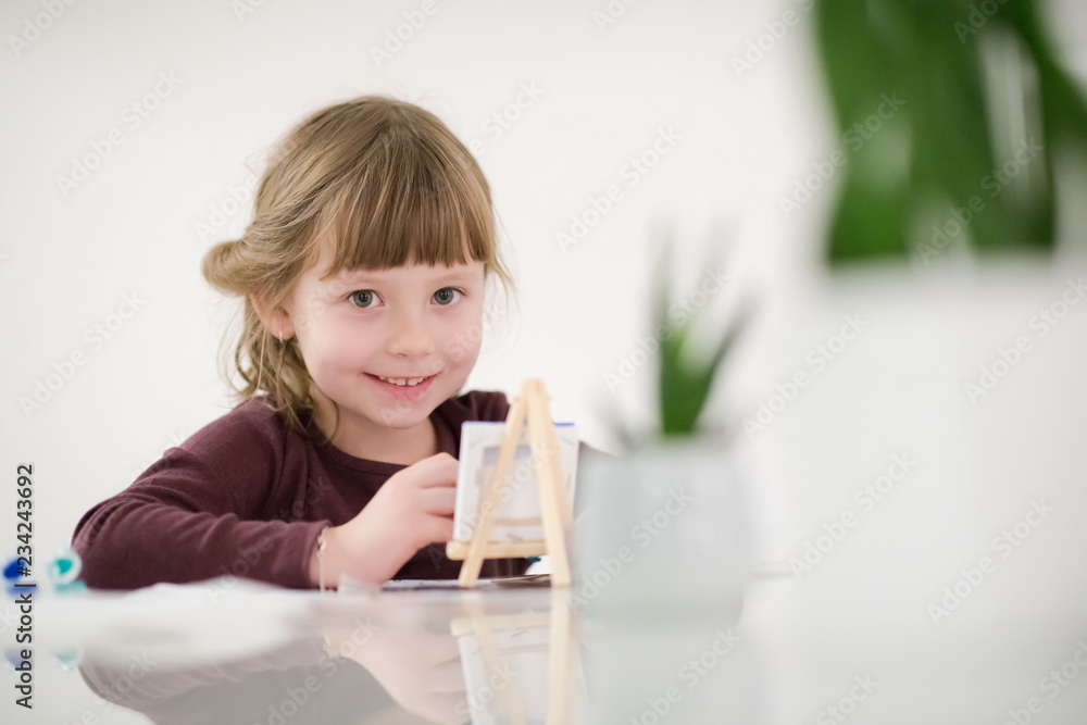 little girl painting on canvas little girl painting on canvas