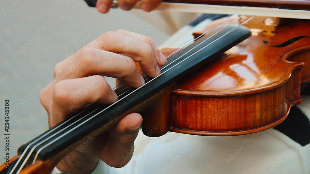 Violin play. Game on the violin. Violin play. Game on the violin.