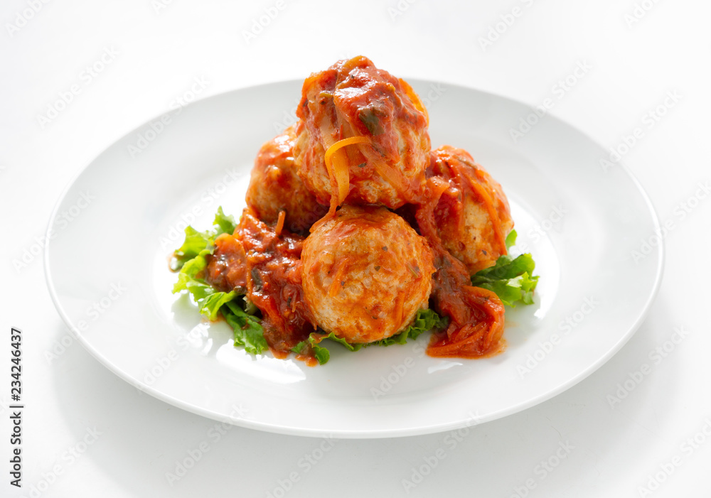Meatballs in a plate on a white background Meatballs in a plate on a white background