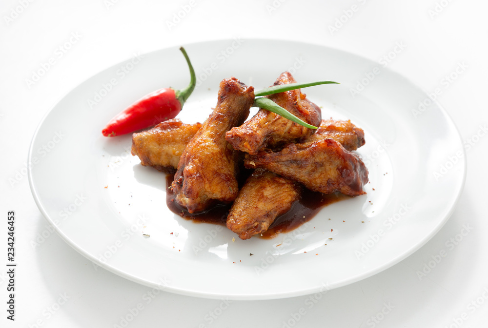Chicken wings in plate on white background Chicken wings in plate on white background
