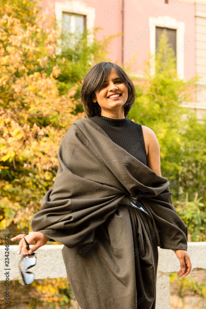 Indian woman posing in an urban context Indian woman posing in an urban context