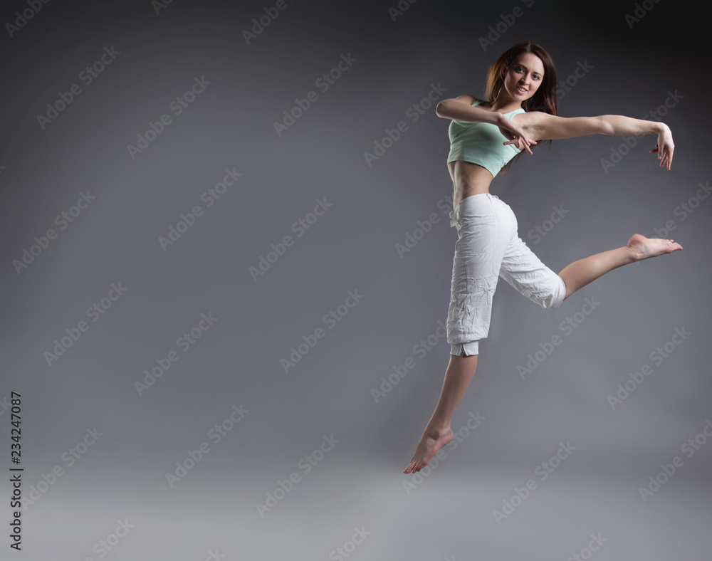 beauty girl dance on grey background