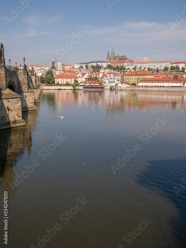 Panorama of Prague with a part of the Charles Bridge and the river. Czech capital.