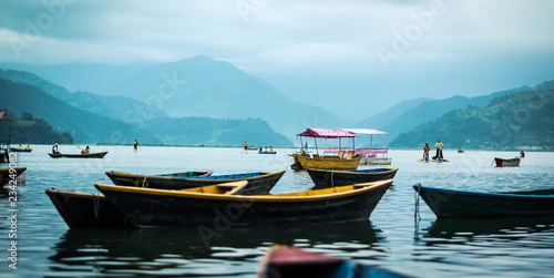 Landscape with boats on the water of Phewa lake, Nepal