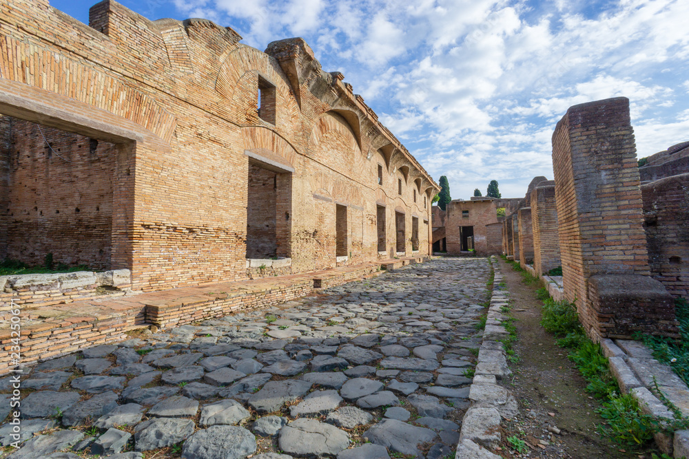 Ostia antica in Rome, Italy. Archaeological Roman empire street view with original ancient Roman buildings Ostia antica in Rome, Italy. Archaeological Roman empire street view with original ancient Roman buildings