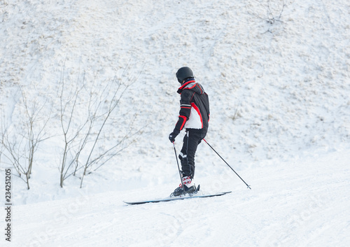 Male skier skiing in fresh snow