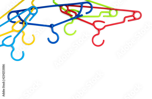 set of colorful plastic clothes hangers isolated on a white background