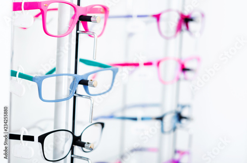 Closeup view of different colorful glasses for kinds on the showcase in the optical store