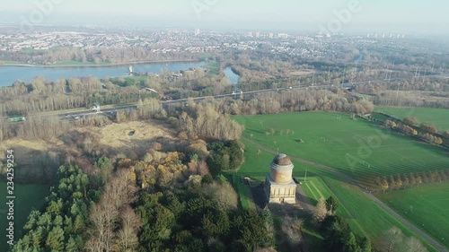 Aerial footage approaching Hamilton Mausoleum, with M74 motorway and townscape of Motherwell. photo