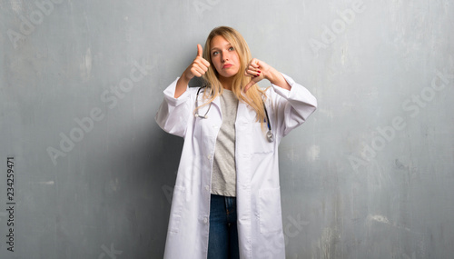 Young doctor woman making good-bad sign. Undecided between yes or not