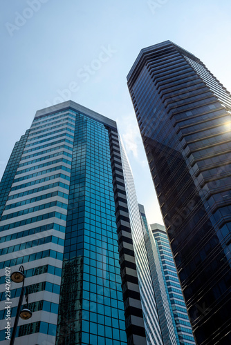 Glass skyscrapers with sun reflection