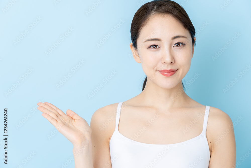 attractive asian woman beauty image on blue background attractive asian woman beauty image on blue background