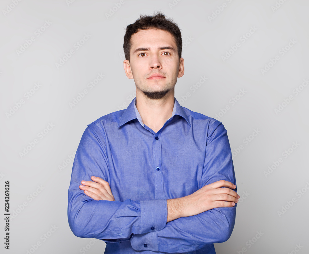 Serious guy crossing hands Serious guy crossing hands