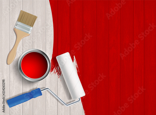 Construction tool with paint on a wooden table.