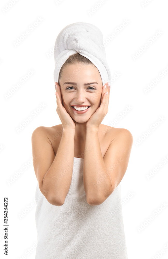 Beautiful young woman wrapped in towel on white background Beautiful young woman wrapped in towel on white background