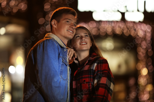 Loving young couple on romantic date in evening