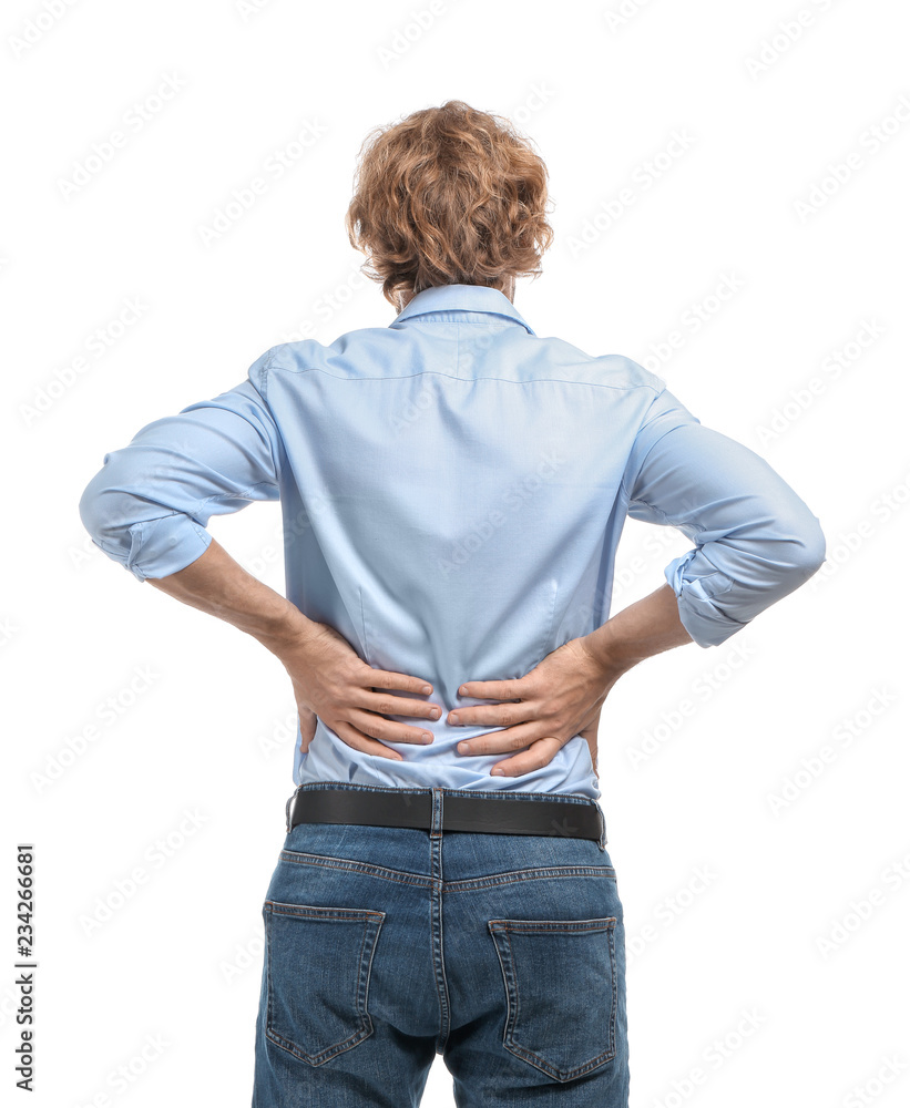 Young man suffering from back pain on white background Young man suffering from back pain on white background